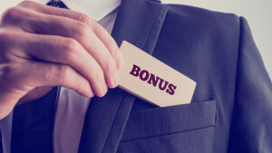 An image of a man taking a card with bonus written on it out of his pocket