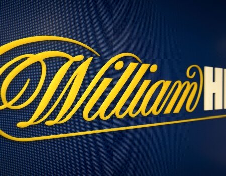 William Hill ends year weak, issues fresh profit warning