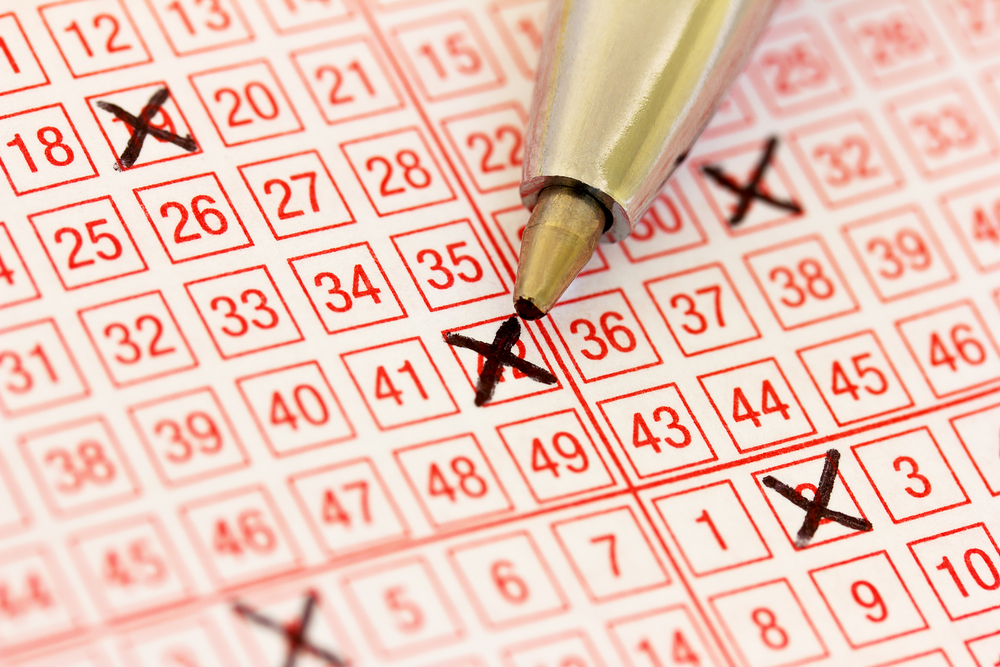 An image of a a lottery ticket with ticked numbers