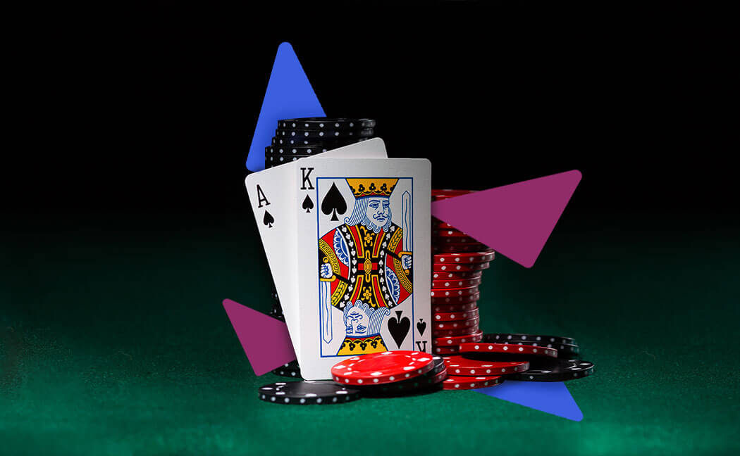 Playing cards and poker chips on a dark background