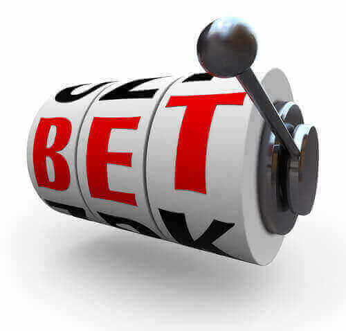 An image of The letters in the word Bet line up for a jackpot on 3 slot machine wheels, symbolizing a jackpot of wealth, money, riches