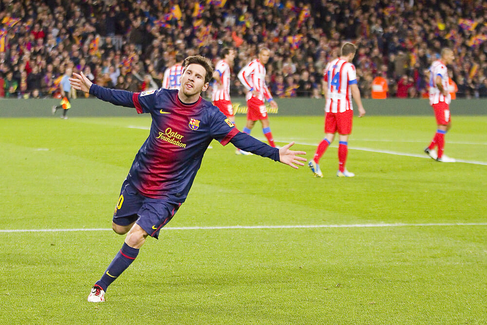 An image of BARCELONA - DECEMBER 16: Lionel Messi celebrating a goal at the Spanish League match between FC Barcelona and Atletico de Madrid, final score 4-1, on December 16, 2012, in Camp Nou, Barcelona, Spai